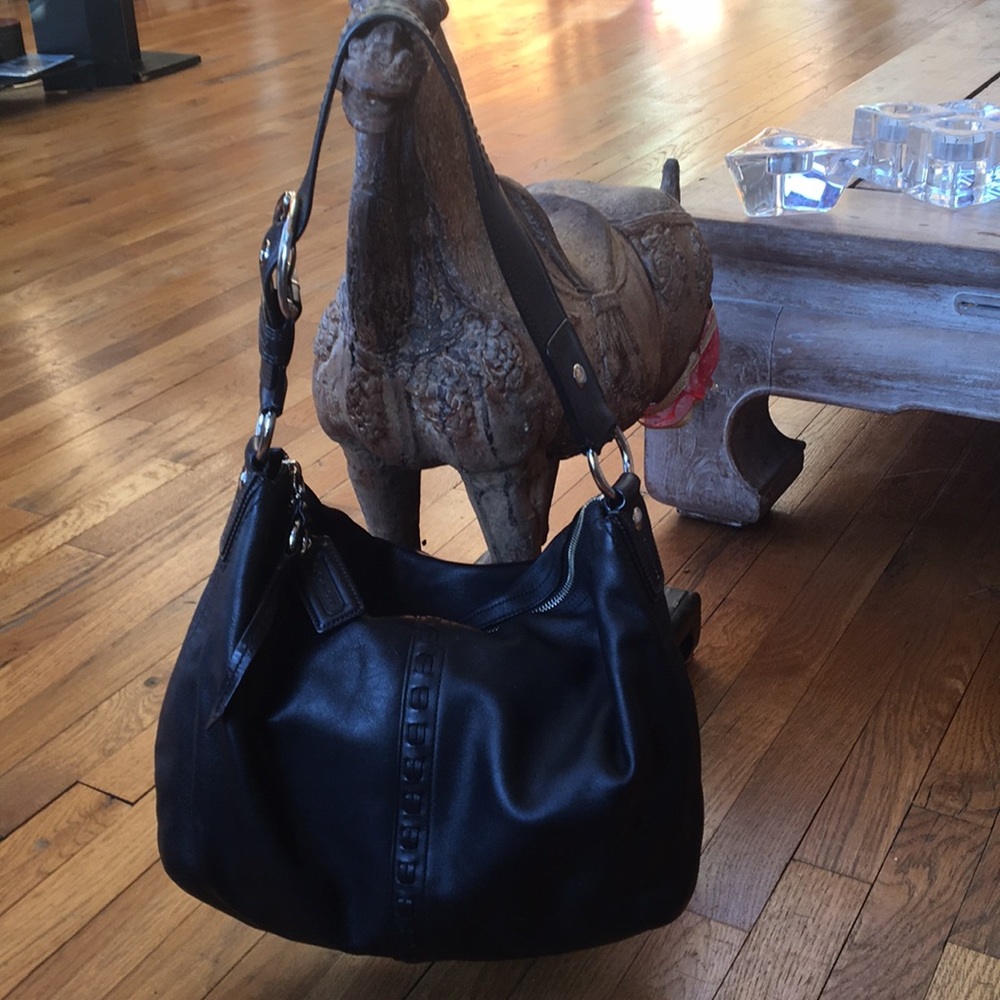 Sleek black large leather Coach bag